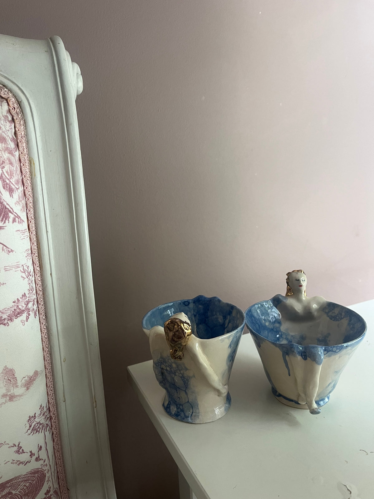 Two Diva tea cup mugs with hand-sculpted figures