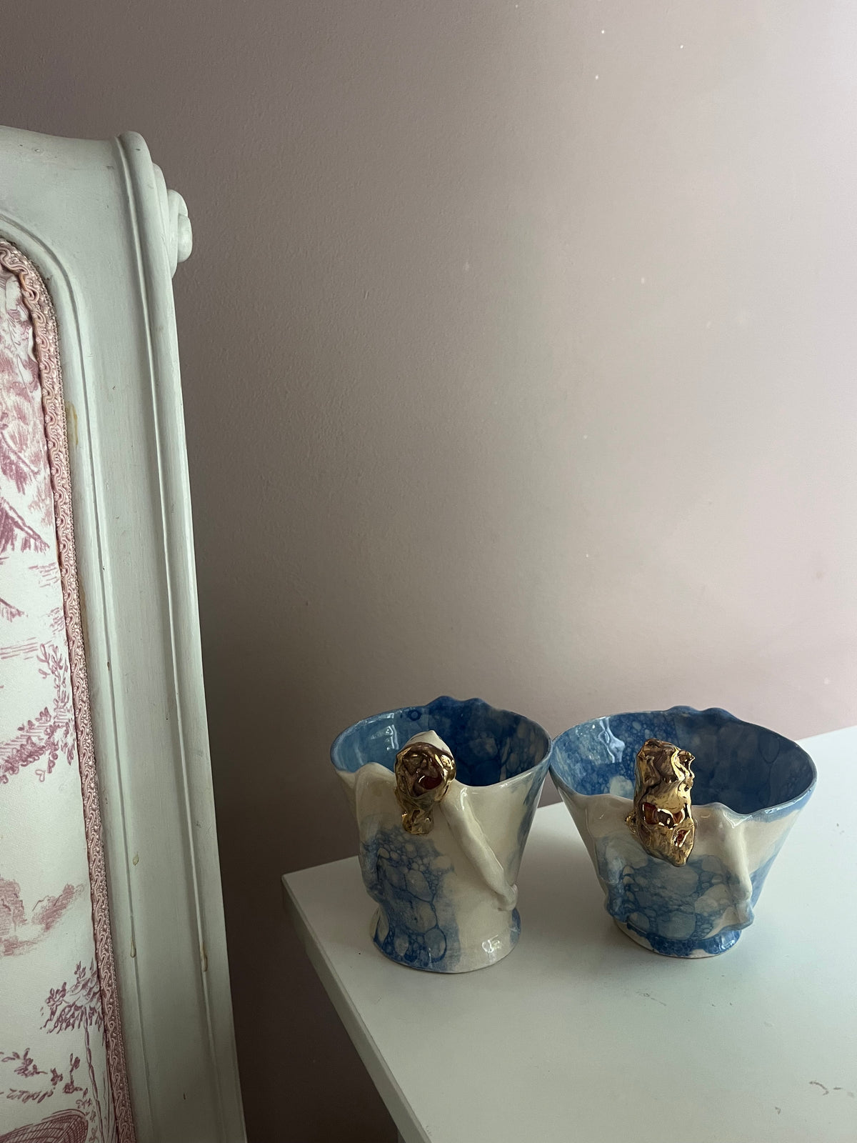 Two Diva tea cup mugs showing the hand-sculpted diva figures